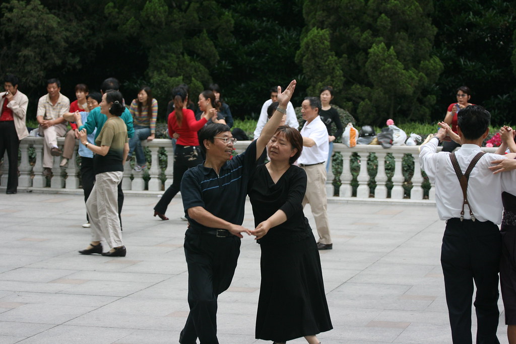 Couples dancing together in a Shanghai park